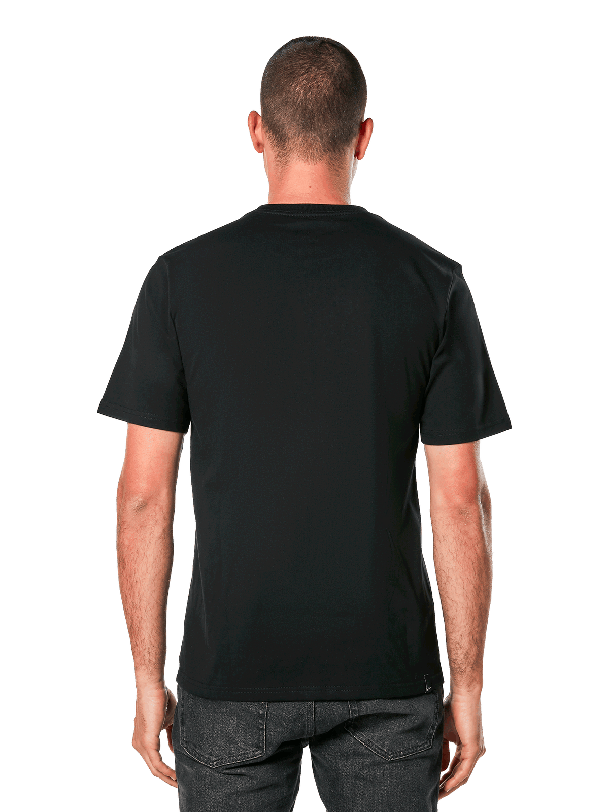 Alpinestars Ride 4.0 CSF Tee, vista posteriore, t-shirt nera a maniche corte, abbigliamento sportivo casual di ispirazione motorsport, indossata da un uomo con jeans scuri