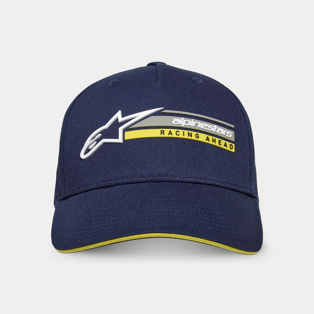 Alpinestars Cappello Par, blu navy, cappellino snapback strutturato con visiera curva, con logo Astars 3D bianco e grafica 'alpinestars RACING AHEAD' grigia e gialla, dettaglio giallo sulla visiera sandwich, streetwear casual da motorsport
