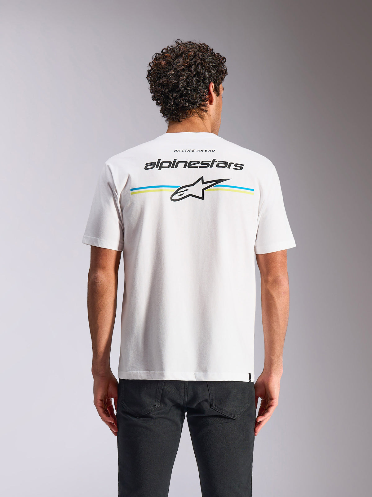 Alpinestars Lanes CSF Tee, t-shirt a maniche corte, bianca, vista posteriore con strisce multicolore e loghi Alpinestars e Astars, streetwear casual motorsport