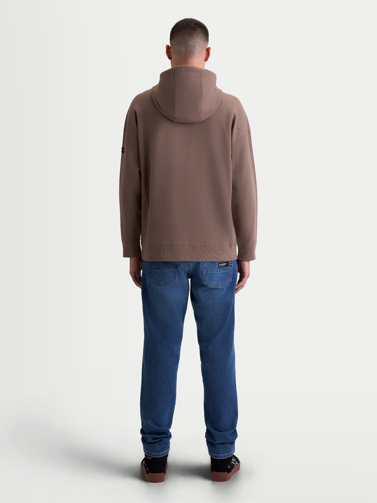 Alpinestars Felpa con cappuccio Camino Textured Oversized, felpa sportswear casual da uomo, marrone taupe, vista posteriore su modello, vestibilità oversized, tessuto in pile twill testurizzato