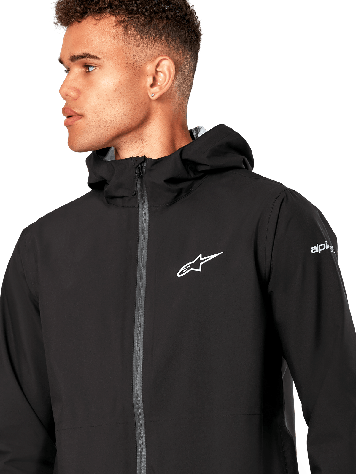 Alpinestars Giacca Antipioggia Kascade, giacca a guscio antipioggia nera, con logo a stella bianco sul petto, cappuccio fisso e cerniera frontale rovesciata rivestita, capospalla tecnico casual ispirato al motorsport