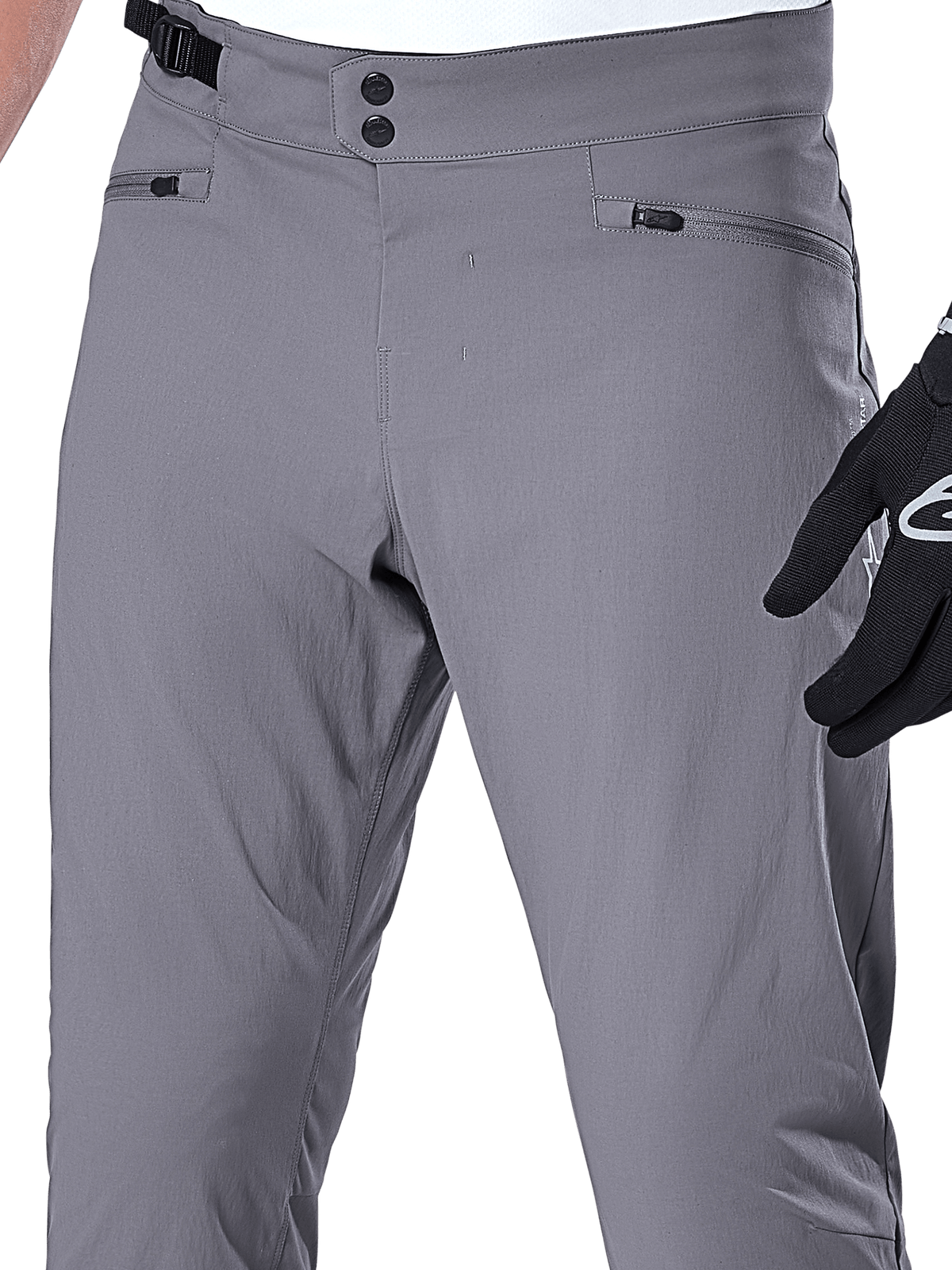 Pantaloni Alpinestars A-Dura, pantaloni MTB, grigio scuro, primo piano della zona vita con doppia chiusura a scatto, regolatore laterale e tasche con zip, tessuto elasticizzato resistente per mountain bike