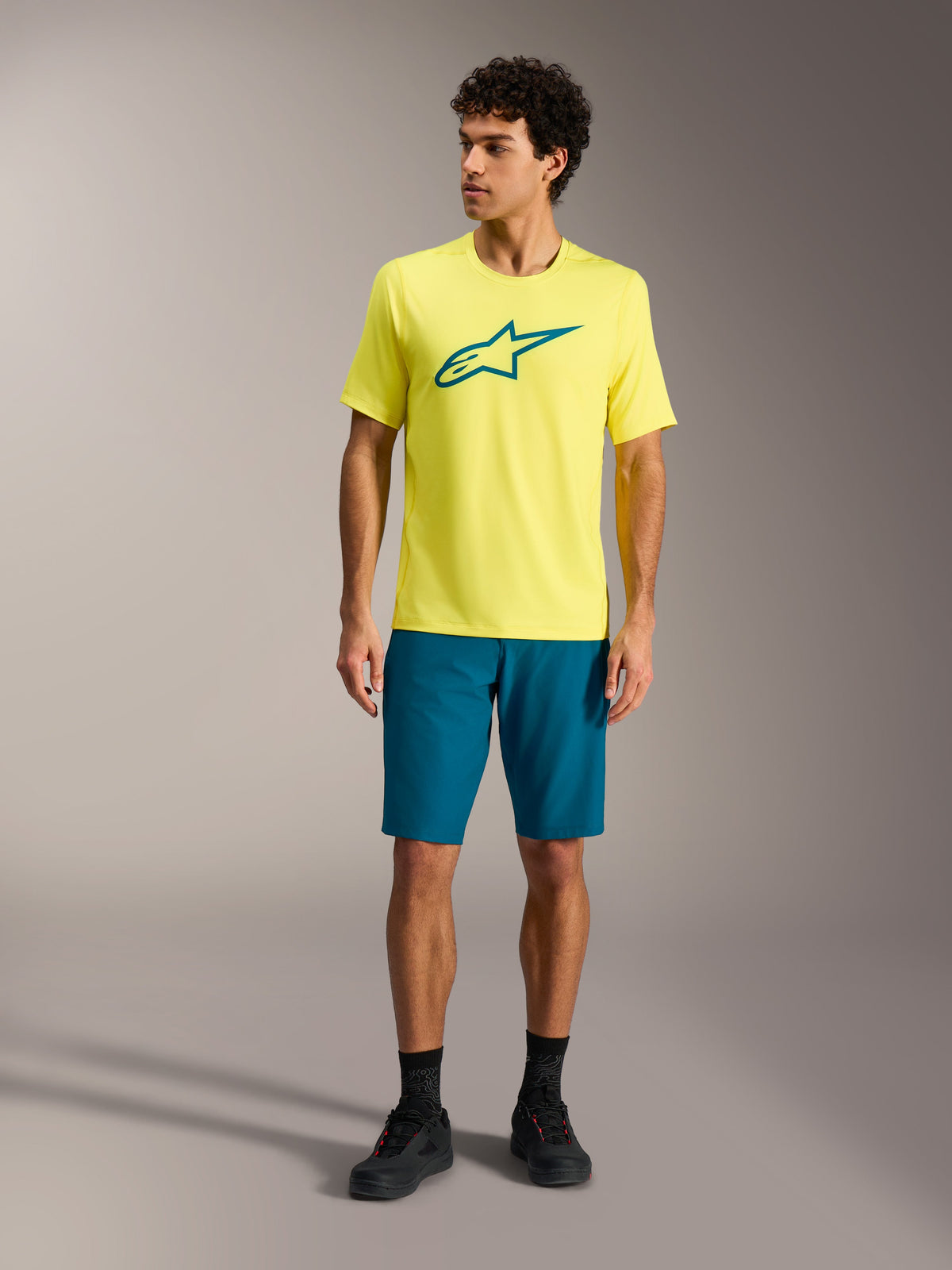 Maglia A-Dura Ride a maniche corte giallo fluo con logo teal, abbigliamento tecnico MTB Alpinestars da uomo.