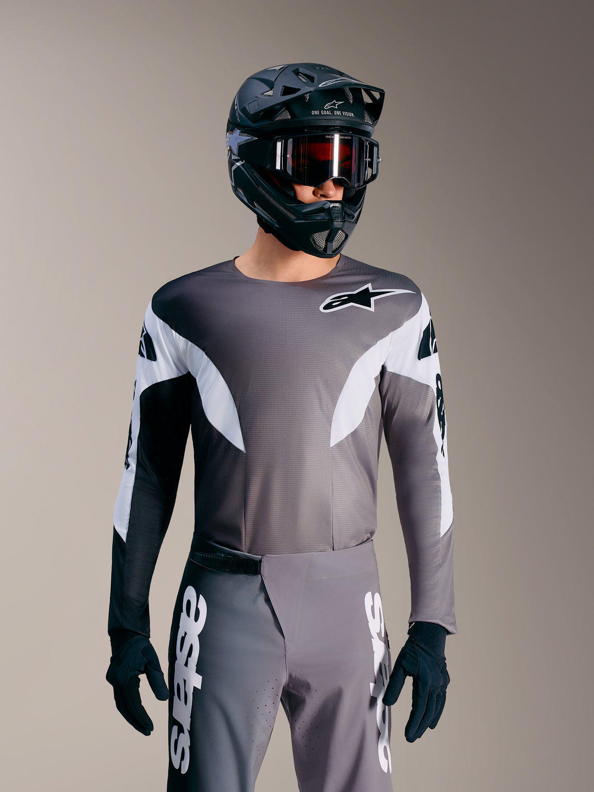Maglia A-Supra Elite grigio sfumato, top da gara MTB microforato con dettagli bianchi e logo Alpinestars.