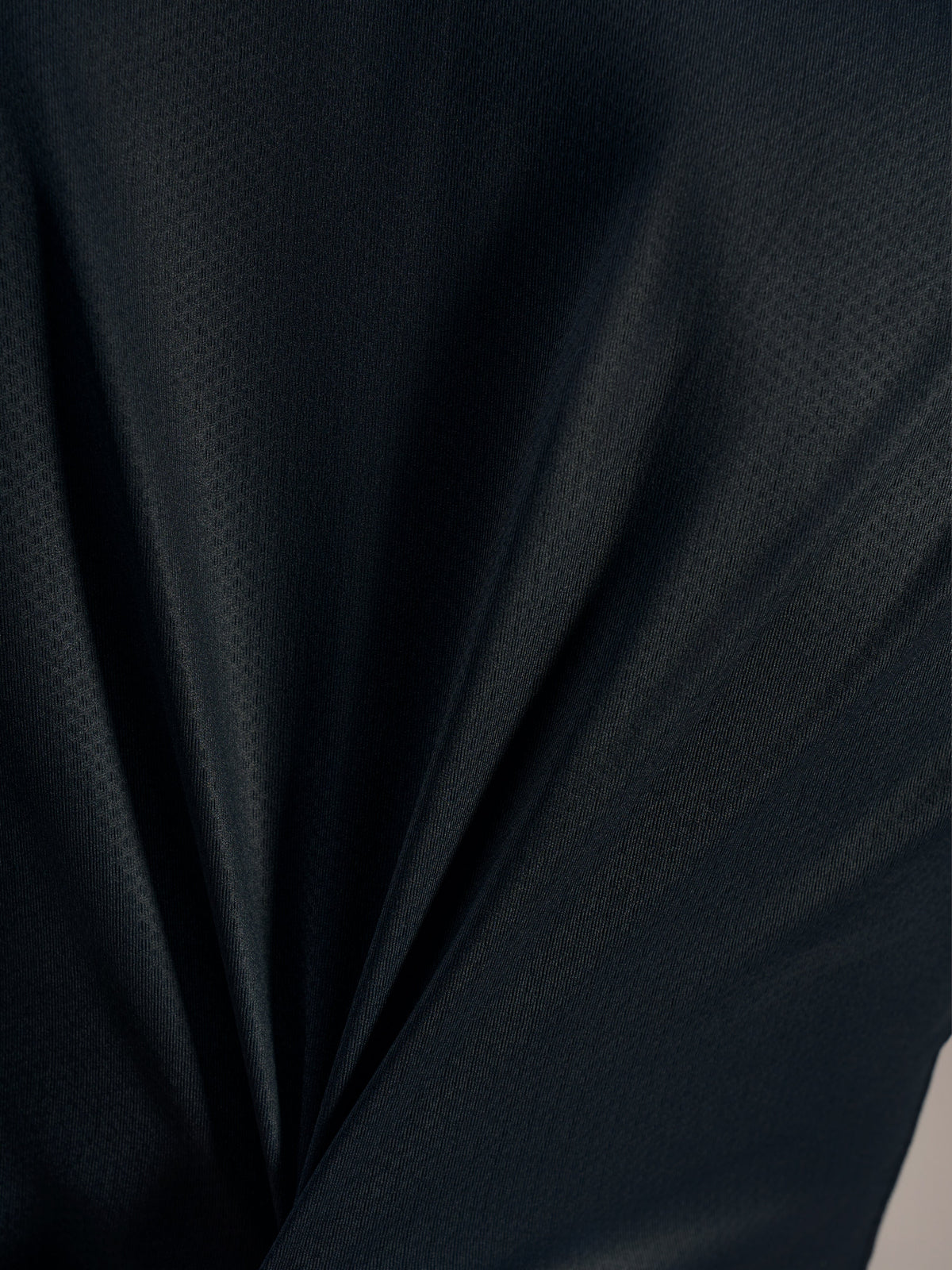 Tessuto jacquard nero della maglia Stella A-Dura Ride: trama traspirante ed elasticità ad alte prestazioni.