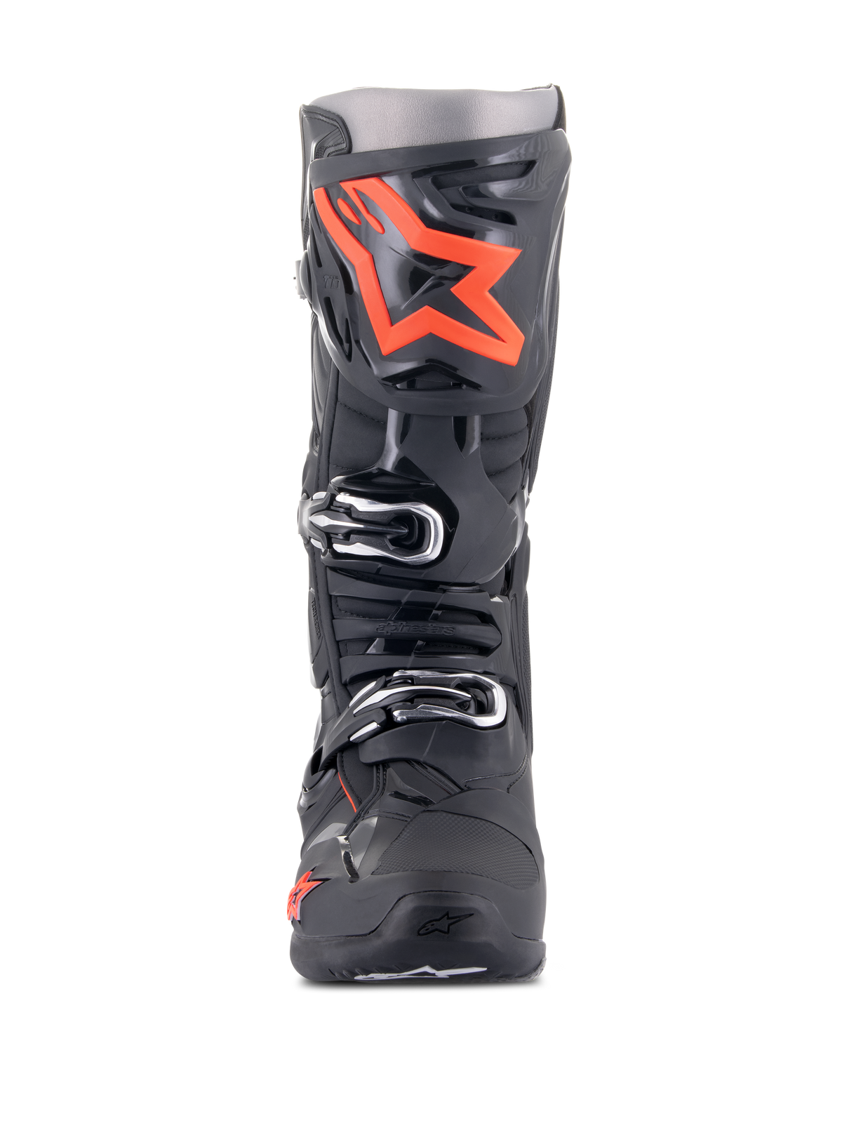 Stivali Alpinestars Tech 10, stivali da motocross, nero e rosso fluo, vista frontale, con un grande logo a stella rosso fluorescente sulla placca parastinchi, fibbie argentate e una resistente struttura in TPU nero.