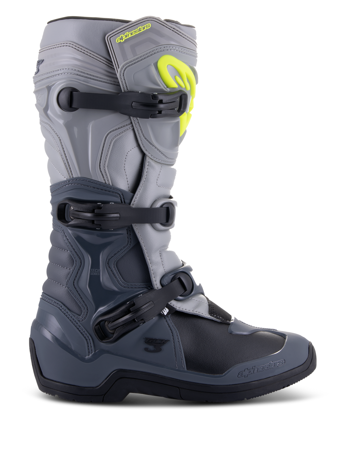 Stivali Alpinestars Tech 3, stivali da motocross, grigio scuro, grigio chiaro e nero, vista laterale con tre fibbie in polimero nero, pannelli di protezione in TPU e logo Alpinestars giallo brillante sulla parte superiore dello stinco