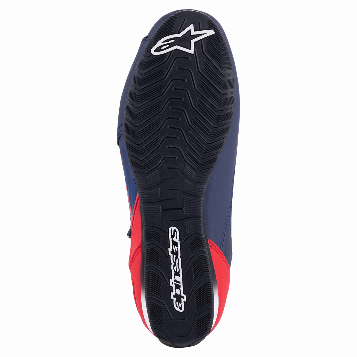 Scarpa da moto Alpinestars Austin, Night Navy e Bright Red, vista dal basso che mostra la suola in gomma nera con trama a onde e logo Alpinestars bianco