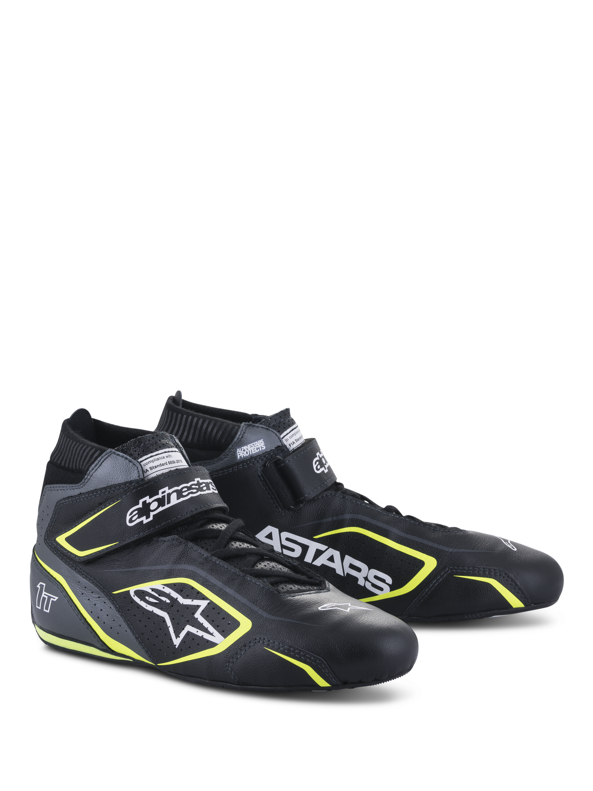 Scarpe Alpinestars Tech-1 T V3 FIA, scarpe per automobilismo, nero, grigio freddo e giallo fluo, struttura interamente in pelle con cinturino a strappo, dettagli giallo fluo, loghi bianchi Alpinestars e ASTARS in evidenza, design professionale da motorsport