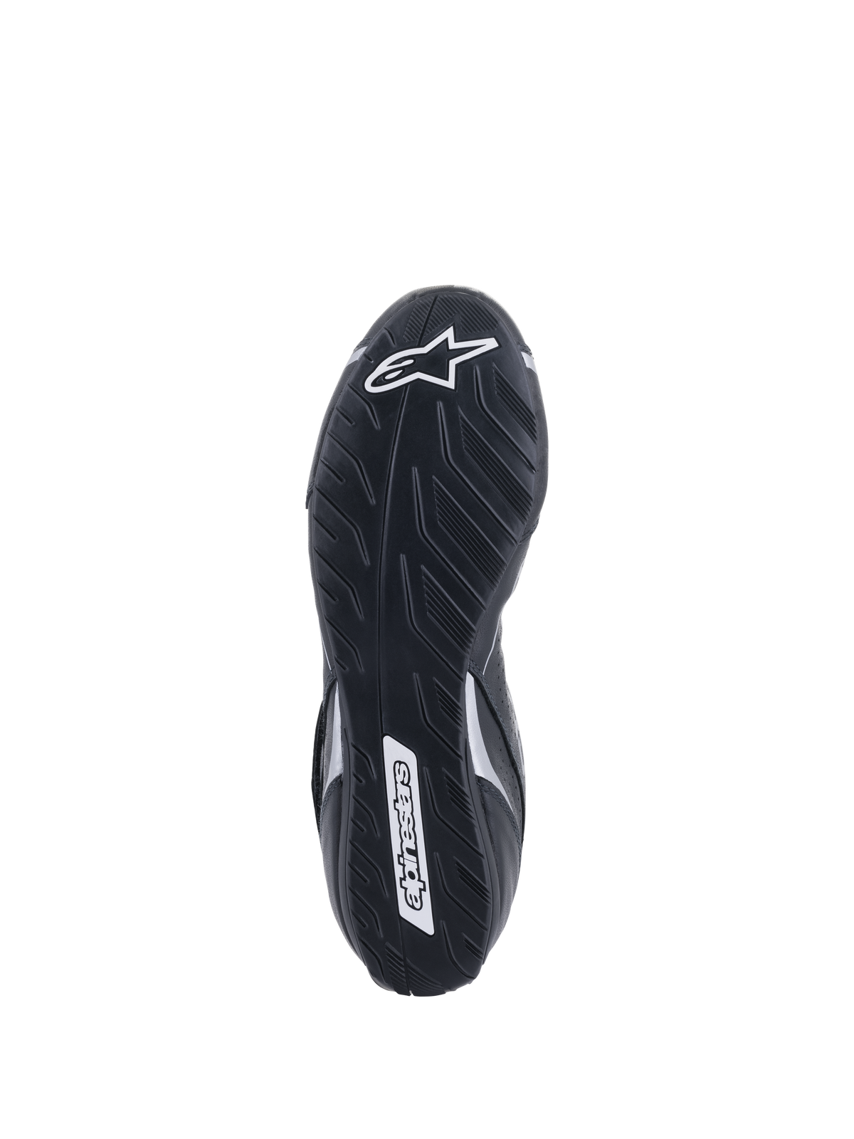 Scarpe Alpinestars Tech-1 T V3 FIA, vista della suola, nero e argento, suola asimmetrica in gomma con disegno del battistrada, logo Alpinestars bianco, mescola sottile per la sensibilità sui pedali