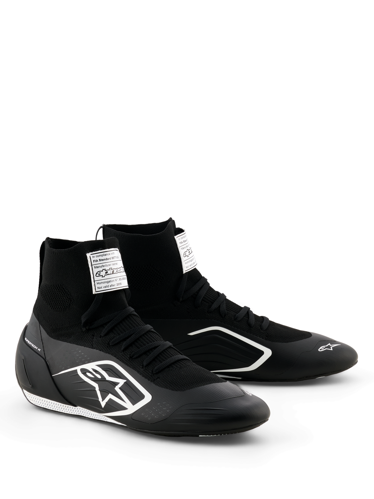 Alpinestars Supertech K Shoes - FIA, scarpe da karting, nero e bianco, tomaia interamente in maglia con calzata alta tipo calzino, logo Alpinestars bianco sul lato, etichetta di certificazione FIA bianca sulla linguetta, design sottile e leggero per prestazioni da gara