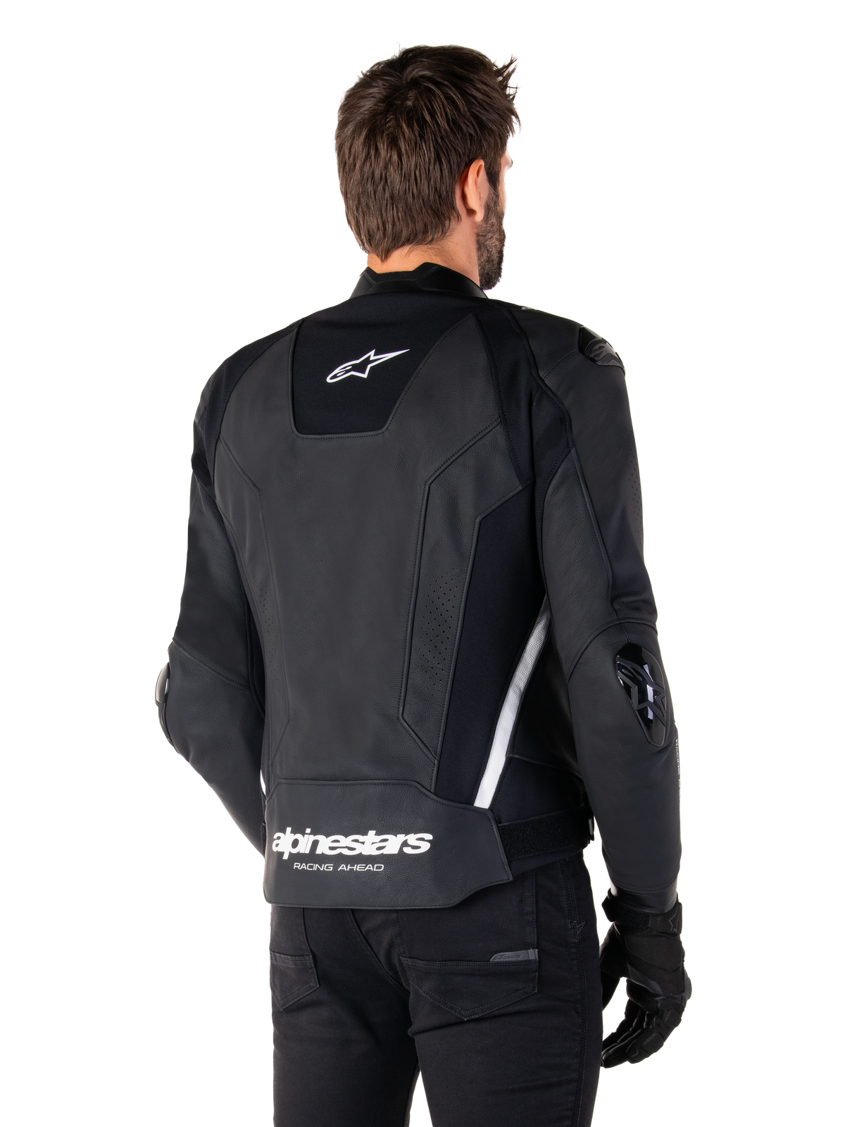 Giacca in pelle Alpinestars Missile V3, vista posteriore, nero e bianco, con logo a stella Alpinestars sulla parte superiore della schiena e scritta sulla parte inferiore, slider protettivi su gomiti e spalle, abbigliamento da corsa in pelle premium