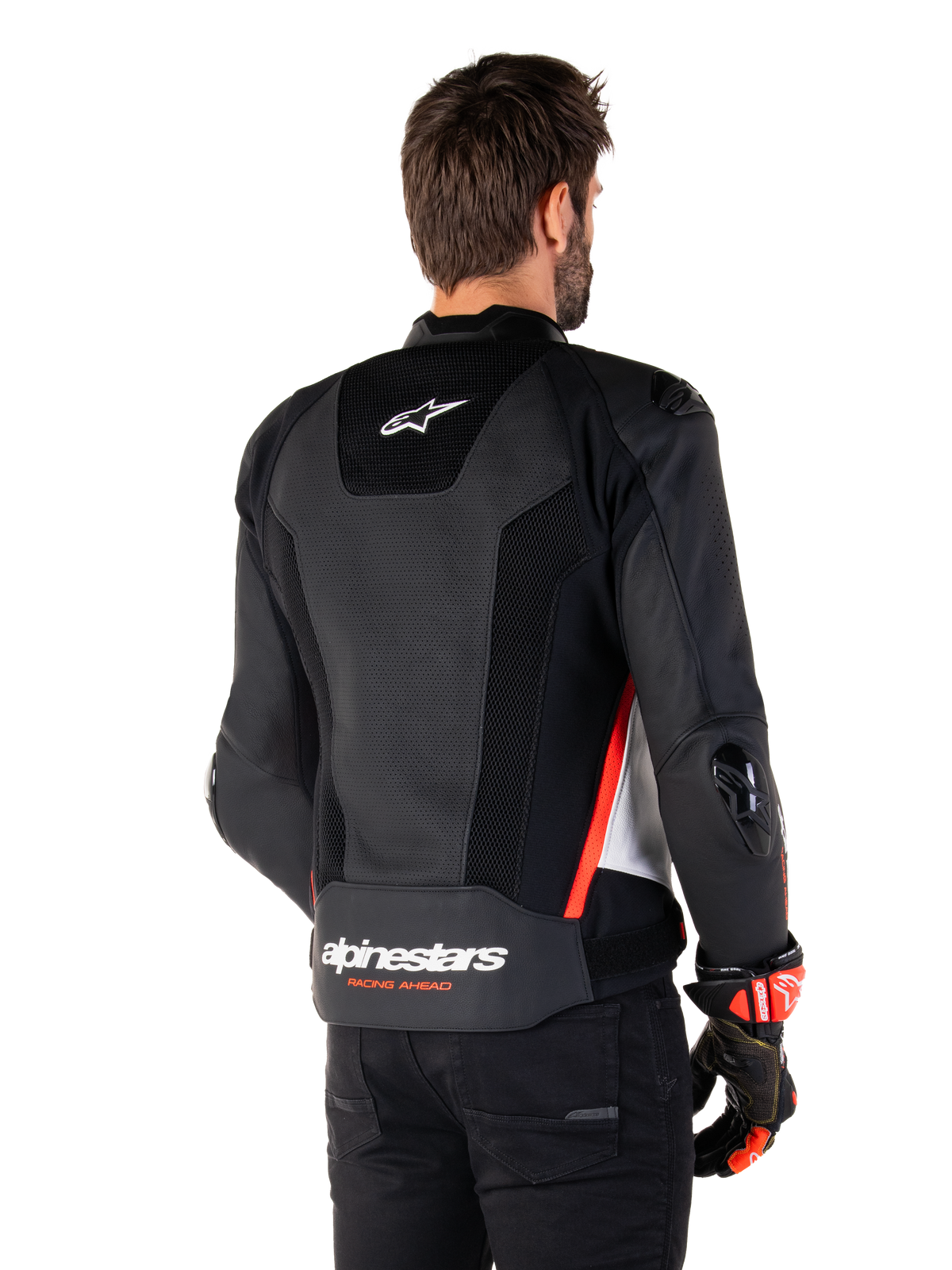 Alpinestars Missile V3 Airflow Leather Jacket, vista posteriore, nero, bianco e rosso fluo, con ampie perforazioni per il raffreddamento, slider esterni DFS su spalle e gomiti e logo Alpinestars sulla parte bassa della schiena.