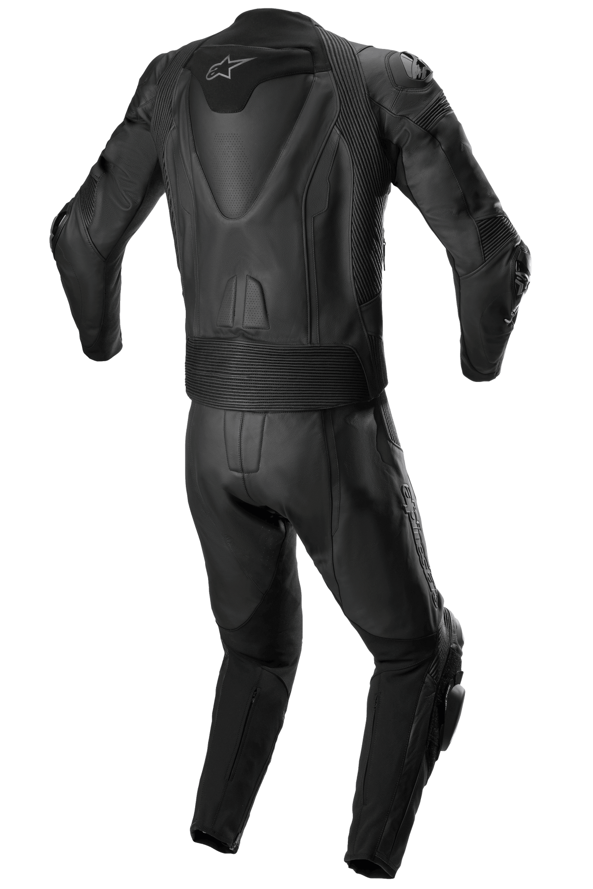 Tuta in pelle Alpinestars Missile V2 2 pezzi, tuta da corsa in pelle, completamente nera, vista posteriore che mostra la gobba aerodinamica con logo a stella bianco, pannelli a fisarmonica elasticizzati in vita e sulle spalle e dettagli in pelle traforata per la guida sportiva in moto