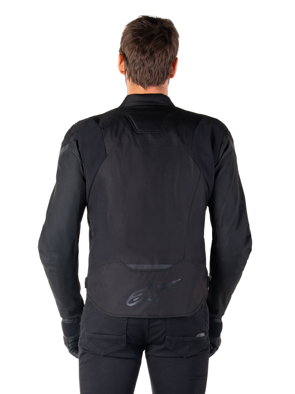 Giacca impermeabile Alpinestars T-Jaws V4, giacca da moto in tessuto, nero, vista posteriore con logo Alpinestars sulla parte bassa della schiena, vestibilità sportiva per la guida su strada