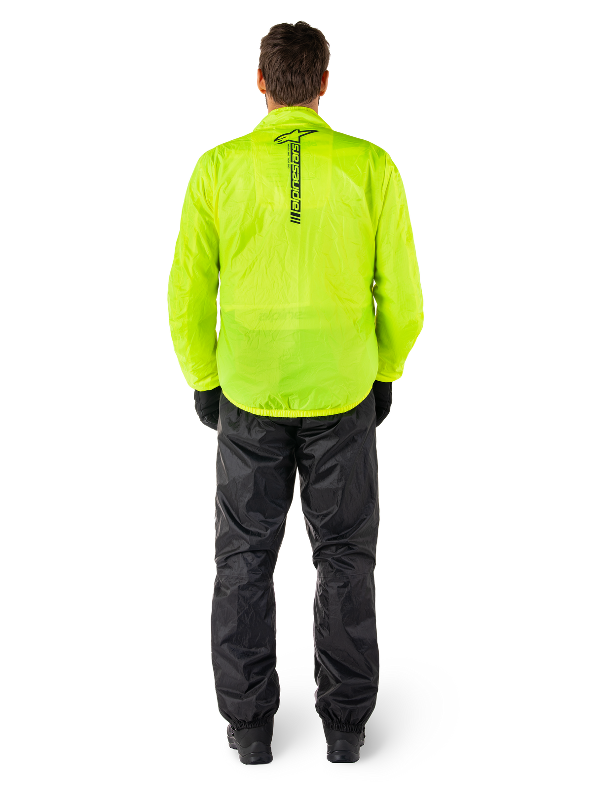 Giacca e pantaloni Alpinestars Hurricane Rain V2, tuta antipioggia impermeabile da moto, giacca giallo fluo con marchio nero verticale sul retro, pantaloni neri, materiale tecnico leggero progettato per la protezione durante la guida in condizioni di pioggia