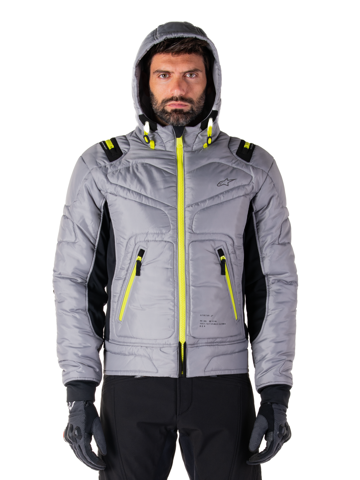 Giacca impermeabile Alpinestars Mohobbs, giacca bomber da moto, Lunar Gray e Lime Punch, design trapuntato con cerniere e dettagli del cappuccio giallo neon brillante, stile urban moto streetwear moderno.
