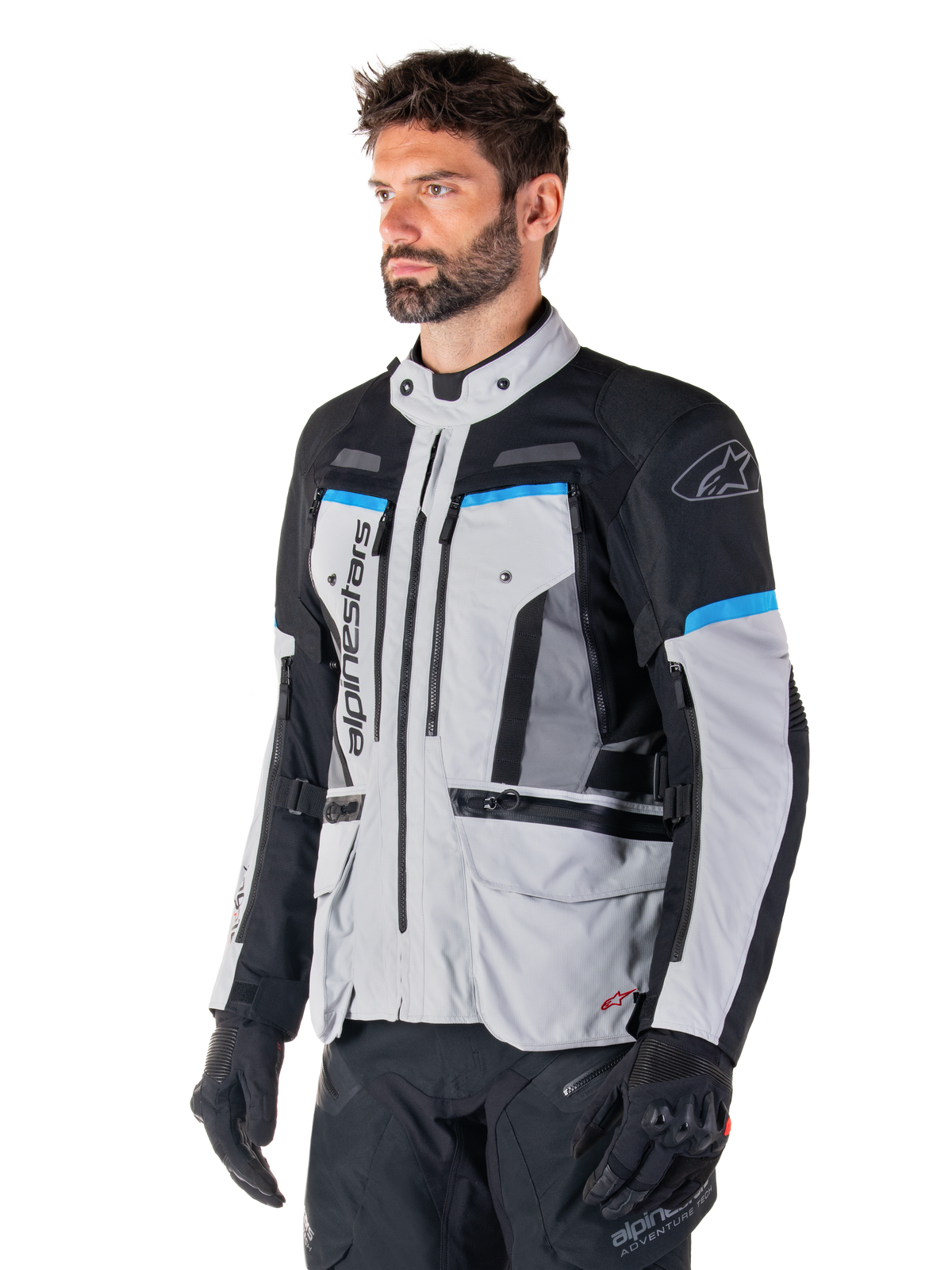 Giacca Alpinestars Bogotá Pro Drystar®, giacca da moto adventure in tessuto da uomo, grigio ghiaccio, nero e ciano.