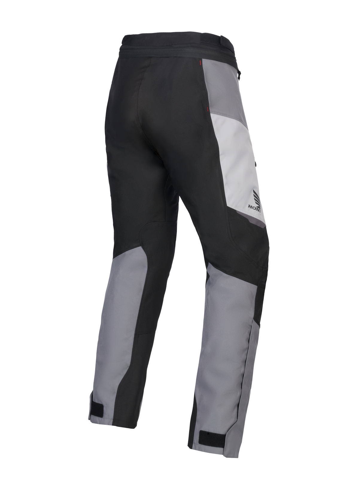 Alpinestars 2025 Honda Stella ST-1 Waterproof Pants, pantaloni da moto touring da donna, Ice Gray, Grigio Scuro e Nero, vista posteriore a tre quarti che mostra la costruzione in tessuto resistente, pannelli color-block grigi e neri, marchio Honda sul fianco e chiusure regolabili alle caviglie.