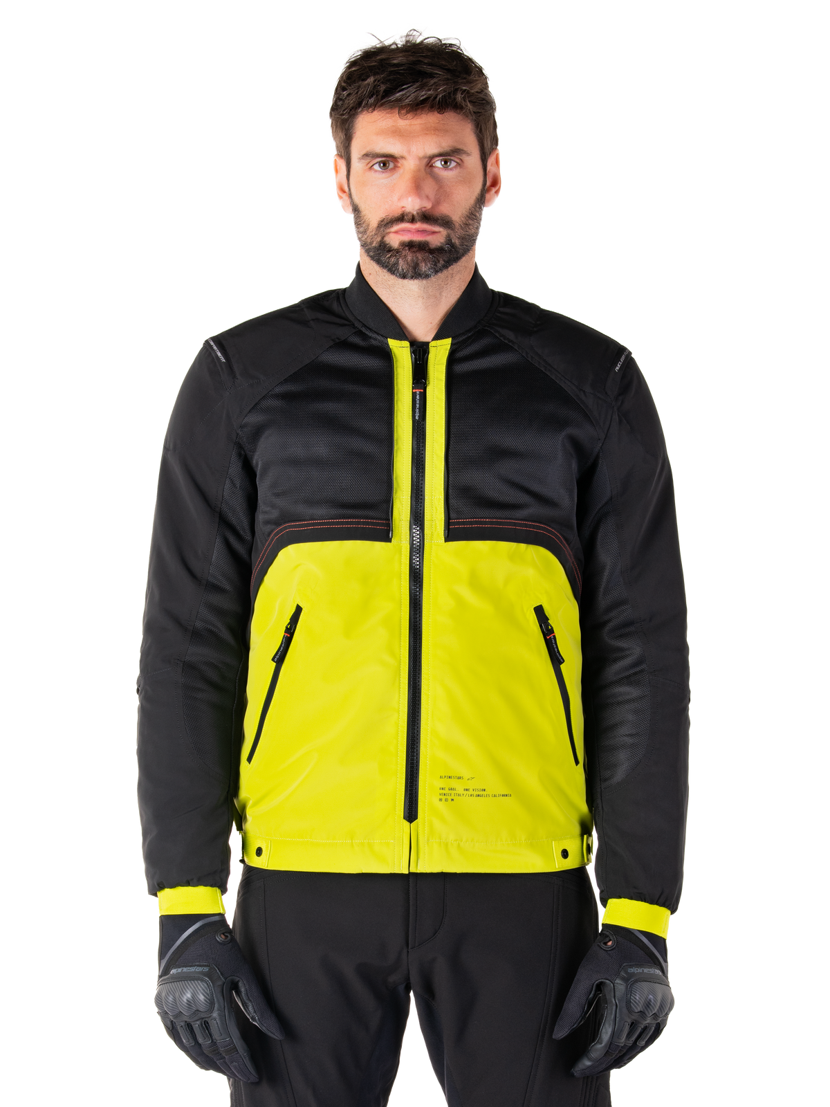 Mootant Waterproof Parka, giacca da moto modulare, Lime Punch e nero, indossata da un modello con guanti e pantaloni neri, caratterizzata da una parte inferiore giallo vibrante e busto superiore e maniche in nero, design utilitaristico per la guida in ogni condizione atmosferica