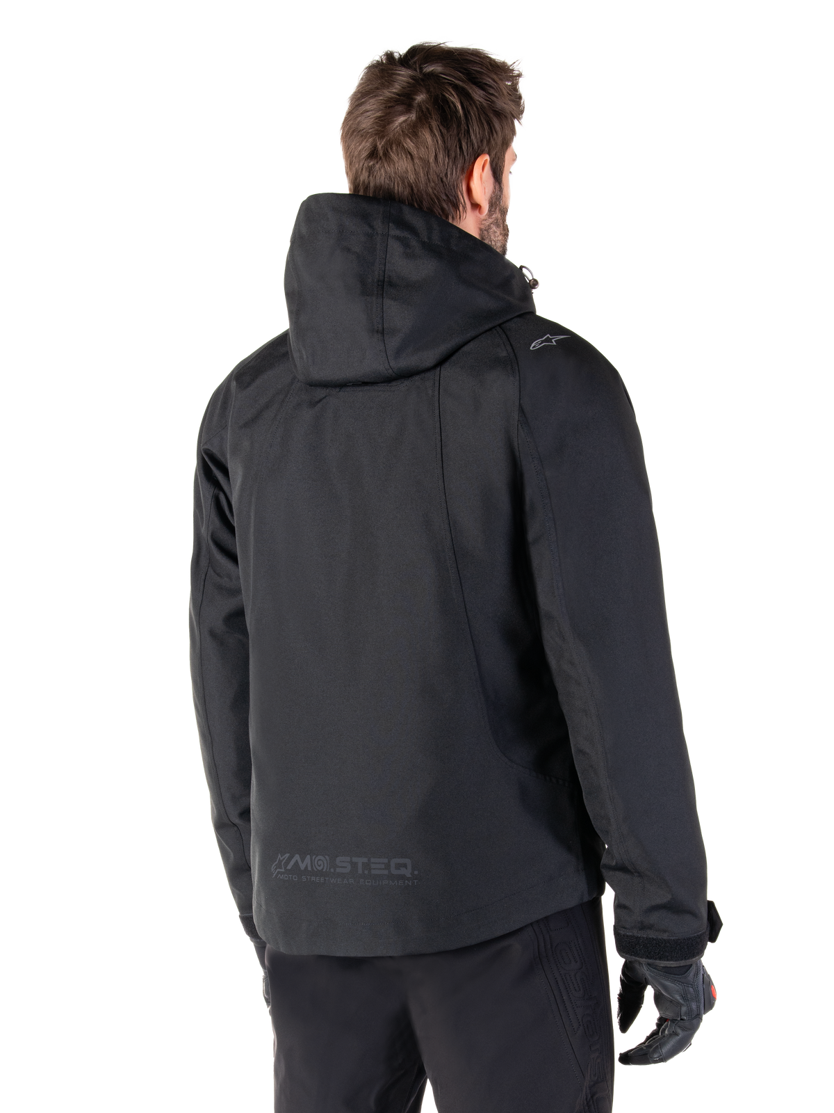 Parka Morush impermeabile Alpinestars, giacca da moto urban nera da uomo, vista posteriore con cappuccio e logo MO.ST.EQ.