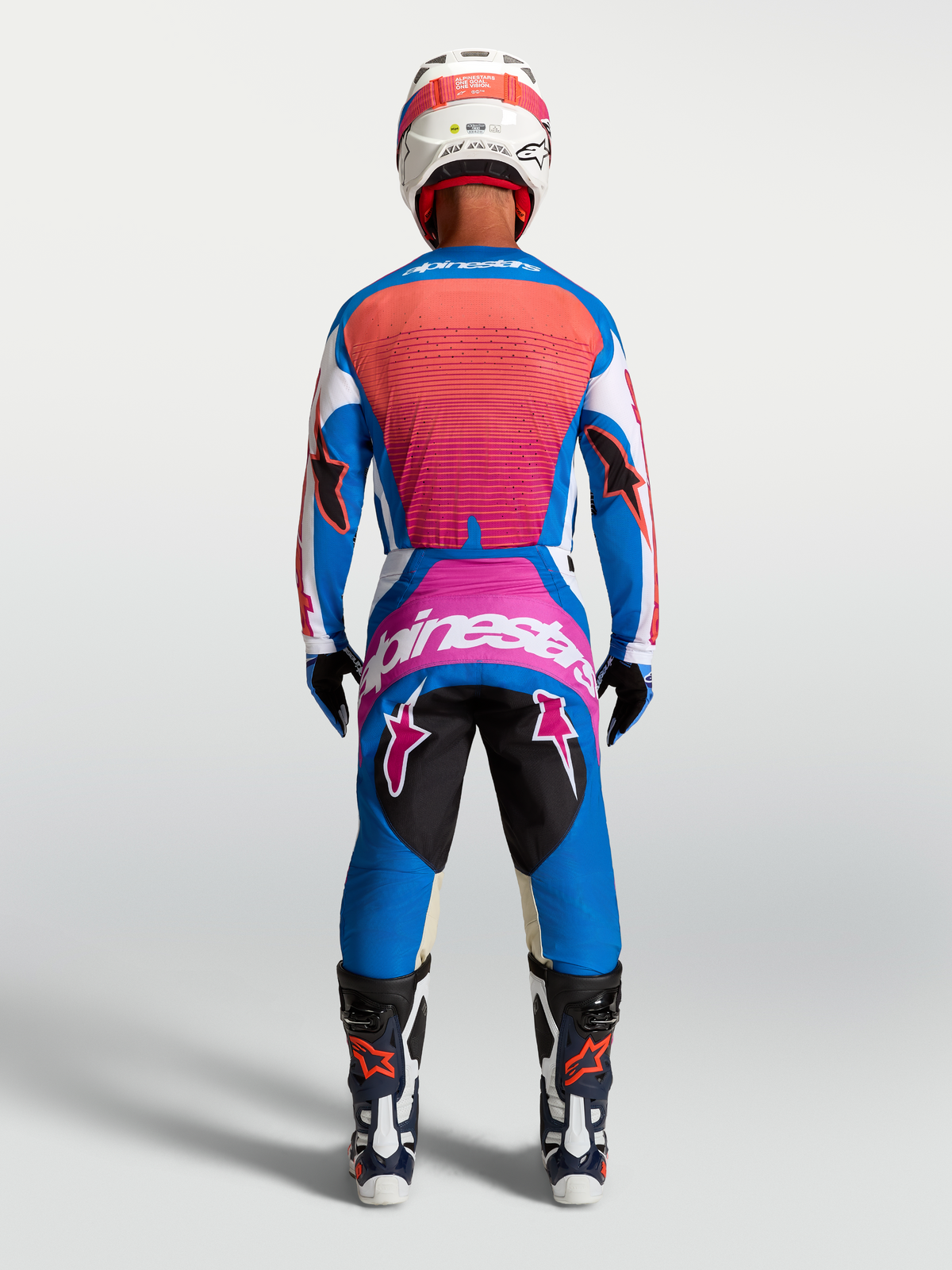 Alpinestars Pantaloni Techstar Maven, pantaloni motocross da uomo, blu e corallo, vista posteriore in assetto da gara.