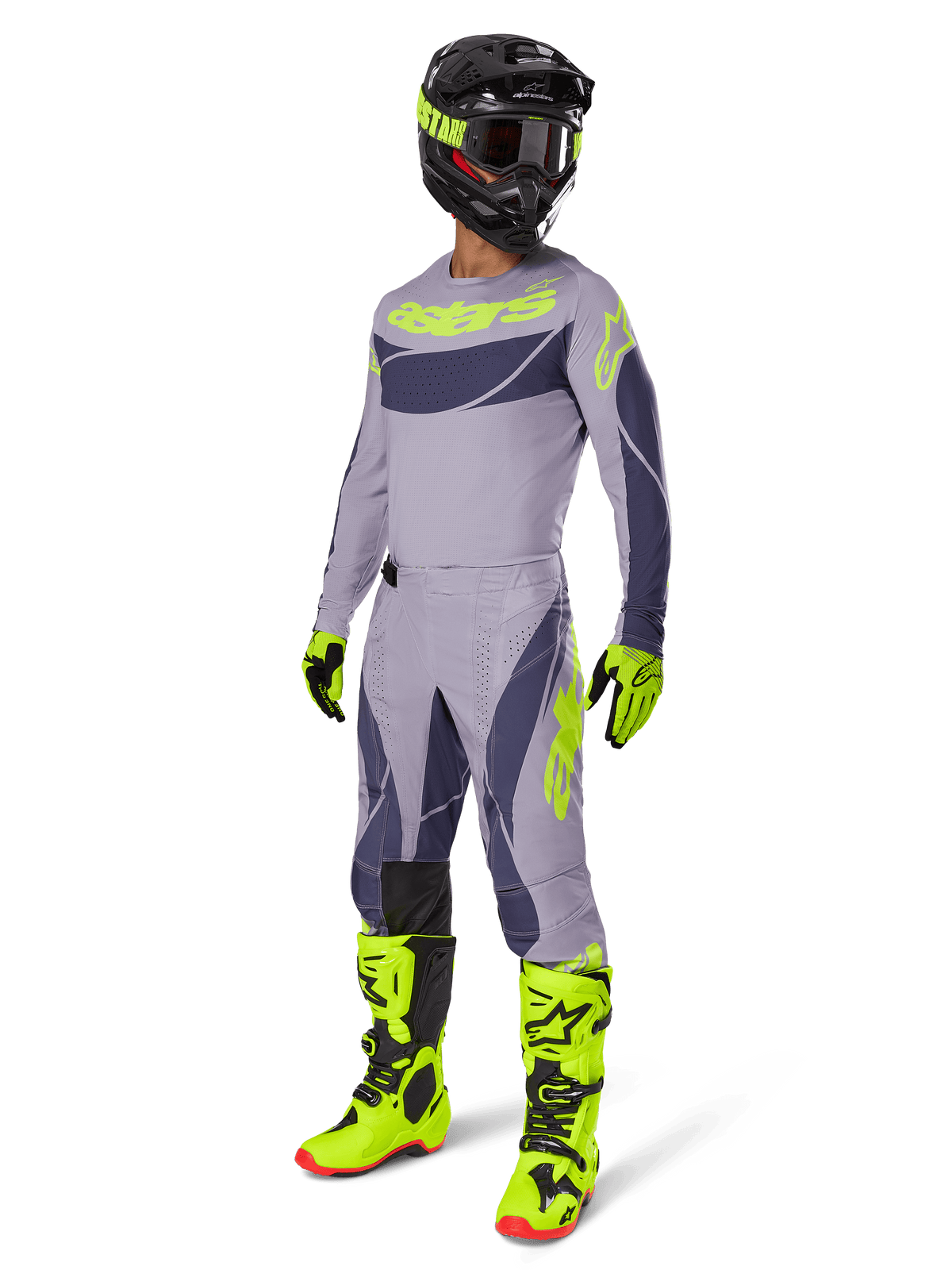 Alpinestars 2025 Techstar Dreem Pants, pantaloni da motocross, grigio e grigio scuro con accenti verde neon, indossati con maglia coordinata, stivali verde neon brillante e casco nero, set completo di abbigliamento professionale da motocross