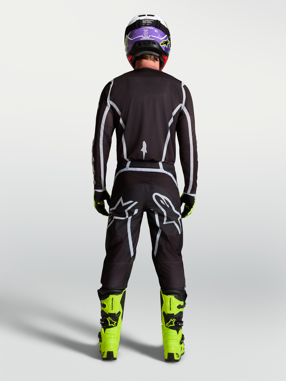 Alpinestars pantaloni Fluid Apex V2, pantaloni motocross uomo neri e argento, vista posteriore, vestibilità sportiva.