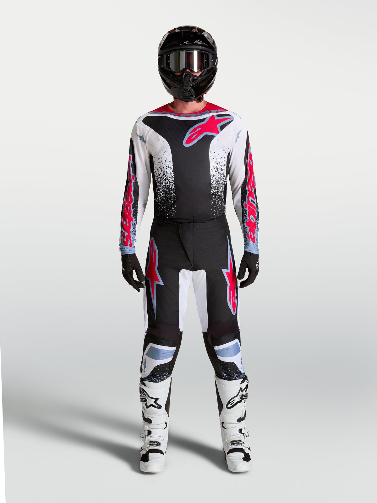 Alpinestars Pantaloni Fluid Drag, pantaloni motocross uomo neri, bianchi e rosso fluo, vestibilità ergonomica per fuoristrada.