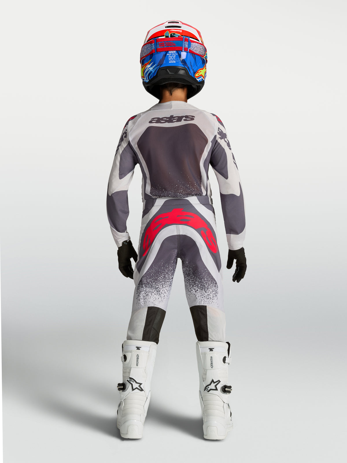 Alpinestars pantaloni Supertech Swan ragazzo 2027, abbigliamento da motocross racing grigio e rosso fluo, vista posteriore