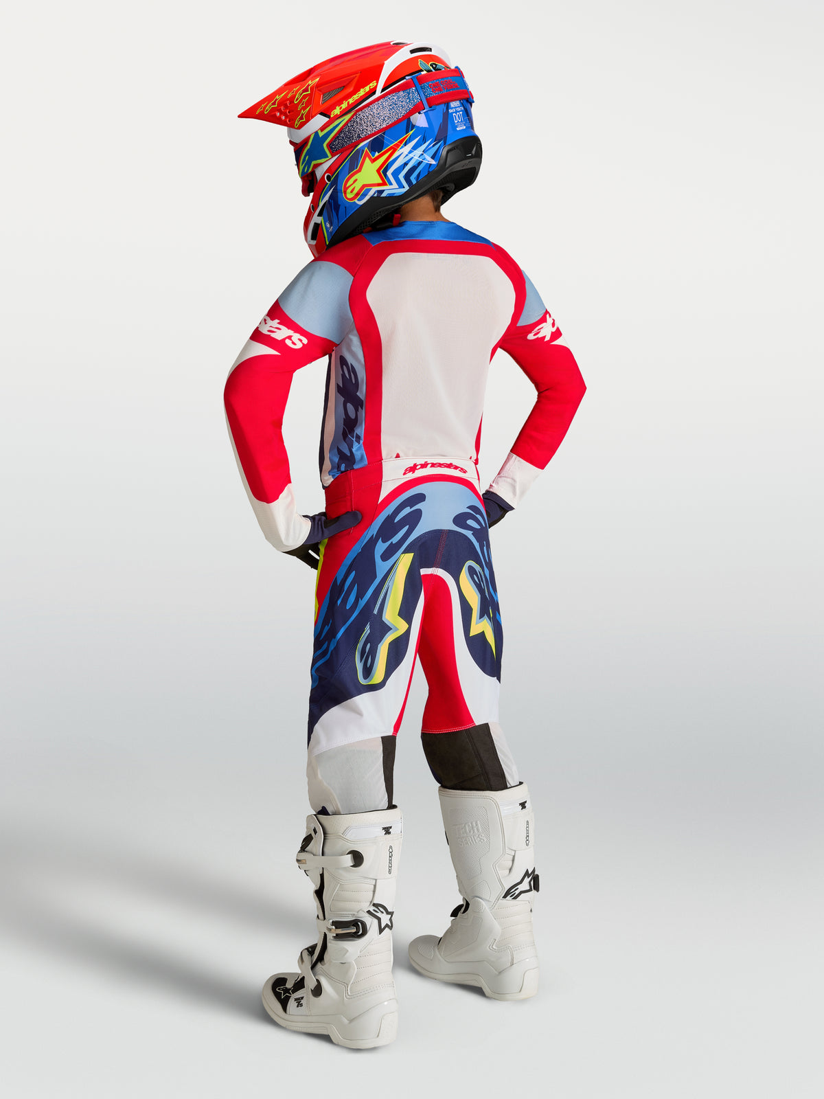 Alpinestars pantaloni Supertech Dyna ragazzo 2027, pantaloni da motocross rosso fuoco e blu navy per prestazioni fuoristrada.