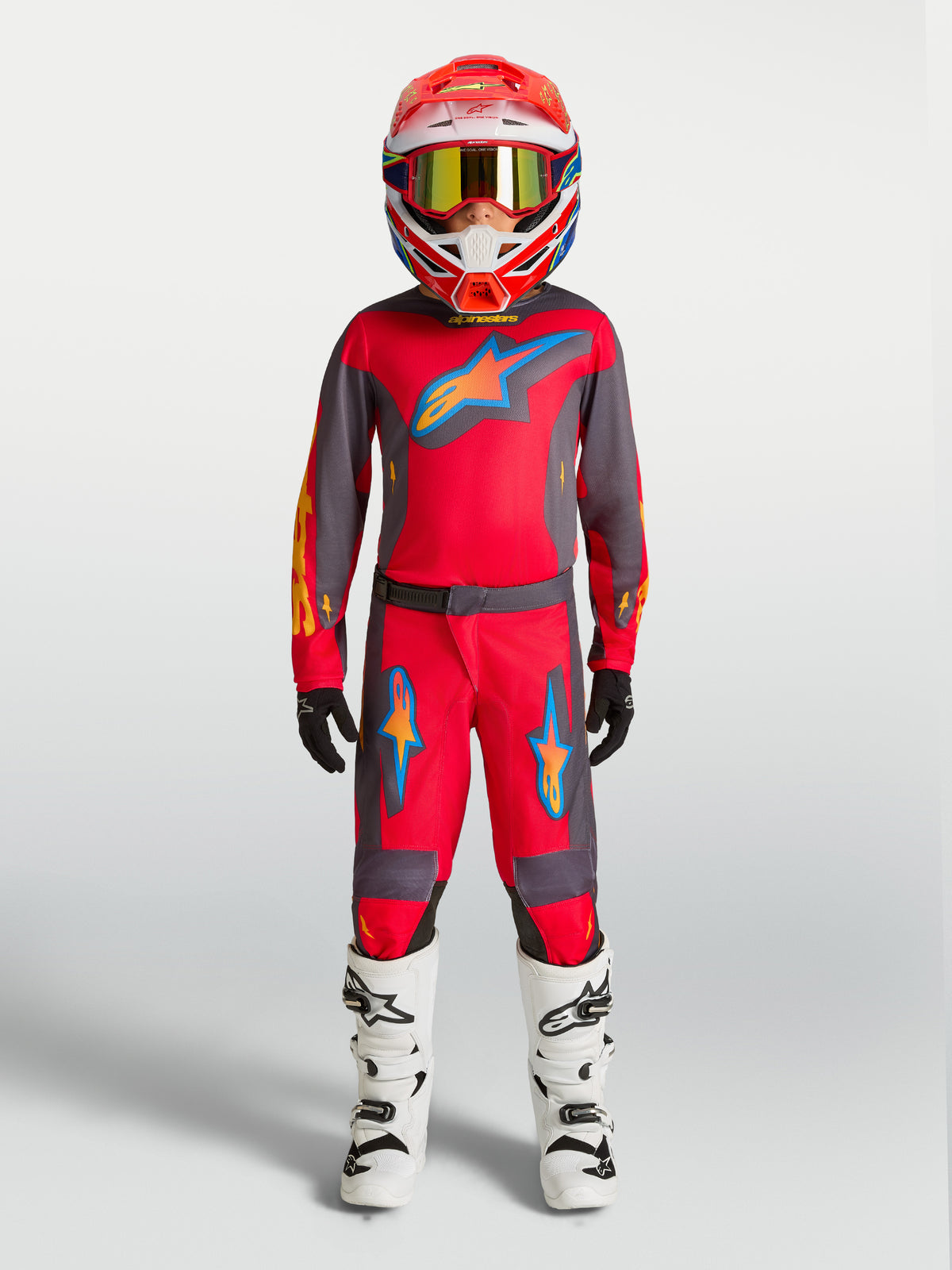 Alpinestars pantaloni Fluid Hunt ragazzo, pantaloni da motocross rossi e grigi, vestibilità sportiva per performance off-road.