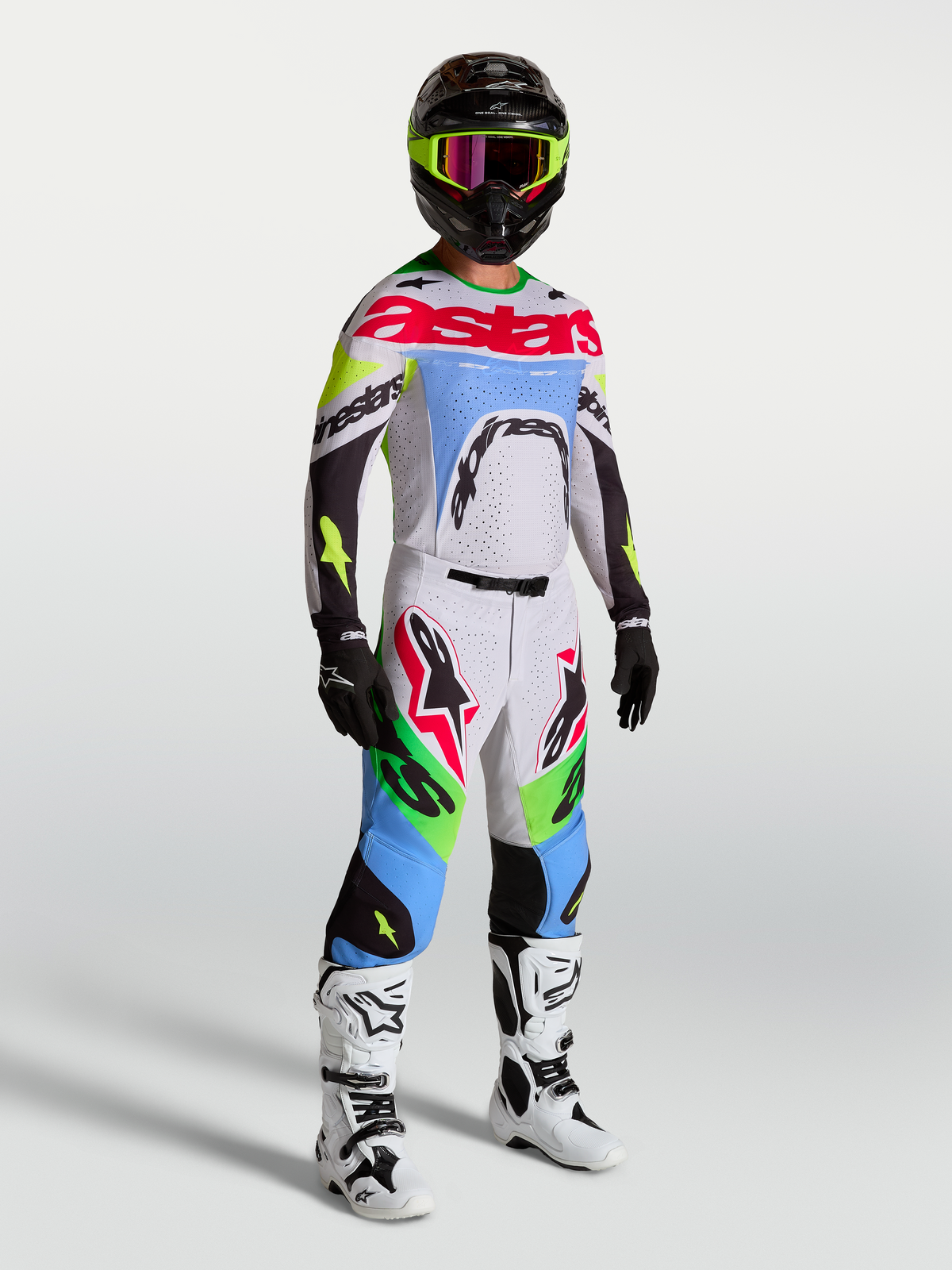 Alpinestars Maglia Supertech Dyna 2027 e completo da motocross, lilla chiaro e verde fluo, vestibilità atletica da gara, abbigliamento tecnico da uomo per fuoristrada.