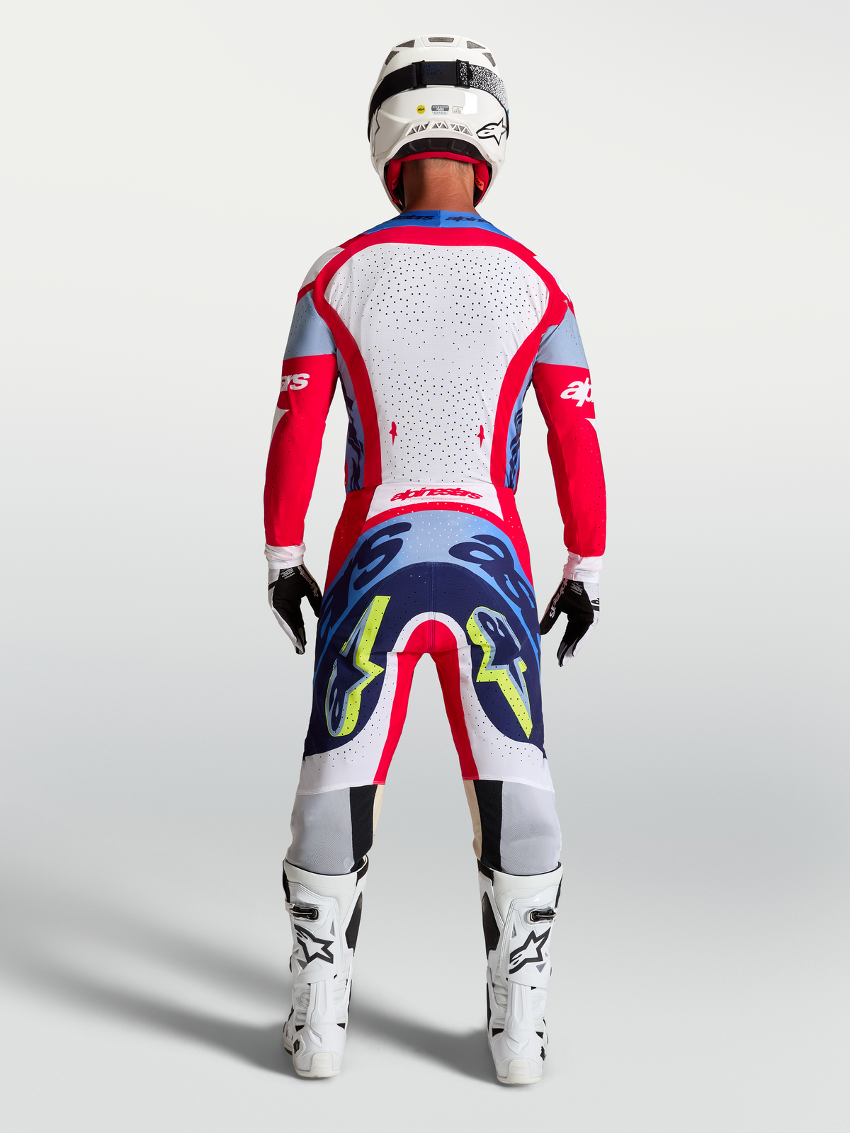 Alpinestars maglia Supertech Dyna e Gear Set 2027, completo da motocross per uomo rosso fuoco e bianco, vista posteriore.