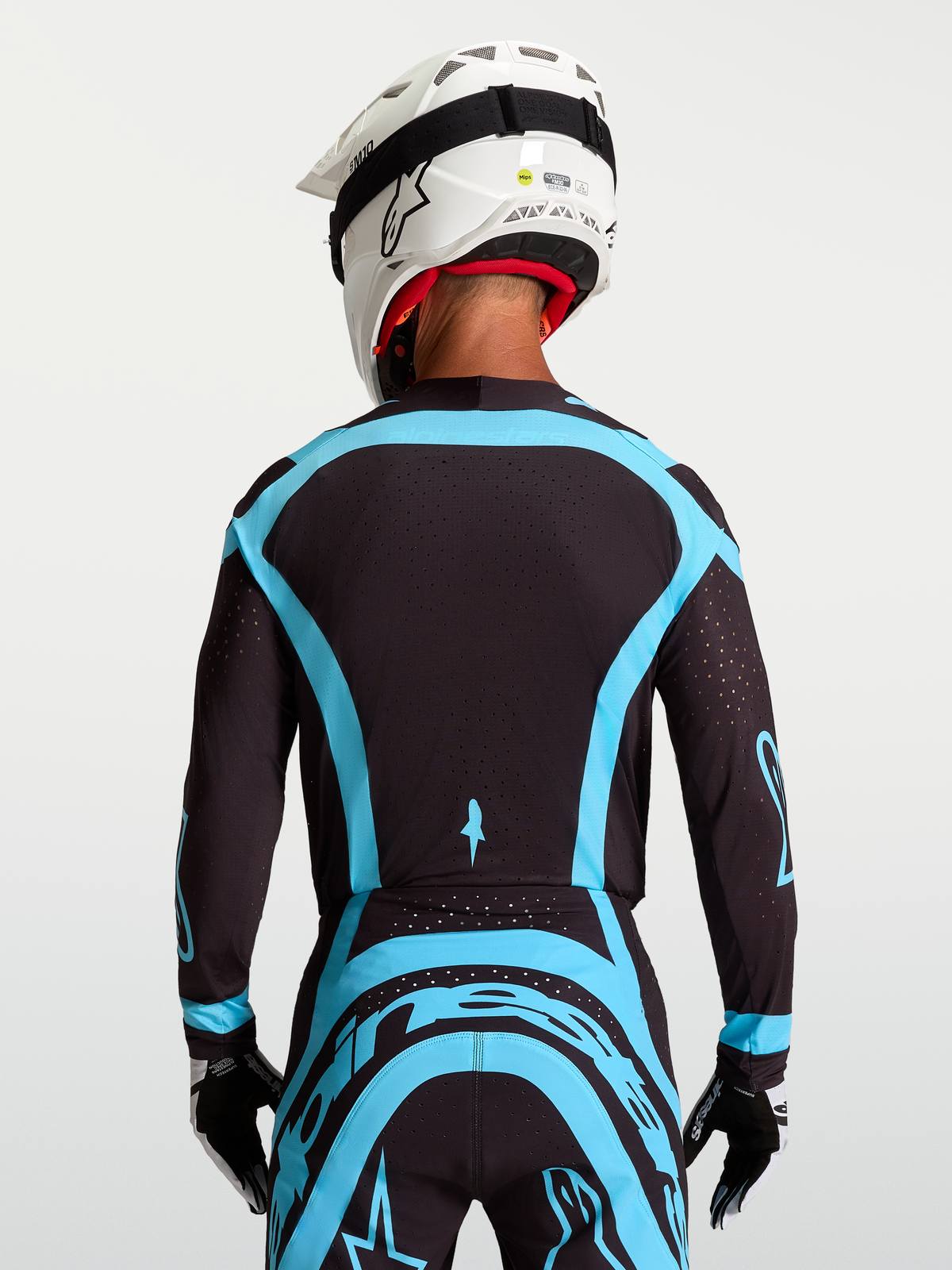 Alpinestars maglia Supertech Vesta, maglia da motocross pro-level per uomo, nero e turchese, in mesh elasticizzato con perforazioni laser, vista posteriore