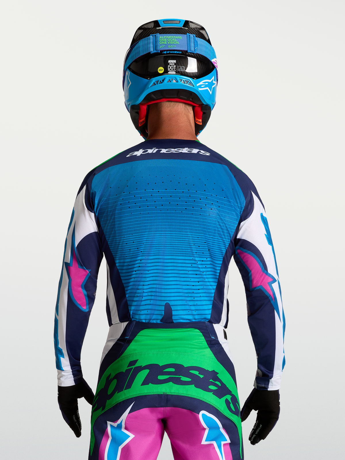 Alpinestars Maglia Techstar Maven, maglia da motocross da uomo, blu e verde con accenti rosa, ventilazione laser, vista posteriore su modello