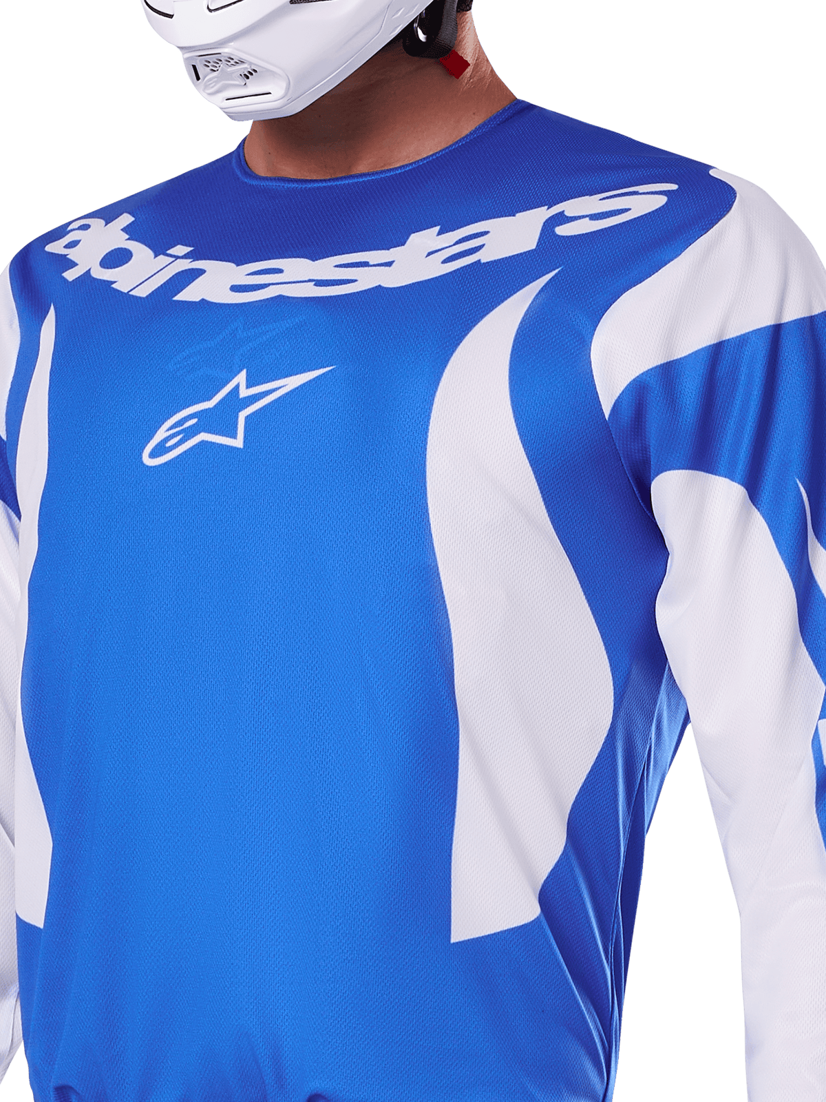 Alpinestars 2025 Fluid Haul Jersey, blu e bianco, indossata da un pilota con casco bianco, con scritta Alpinestars e logo A-star bianchi, vestibilità atletica, materiale leggero e traspirante per motocross e off-road