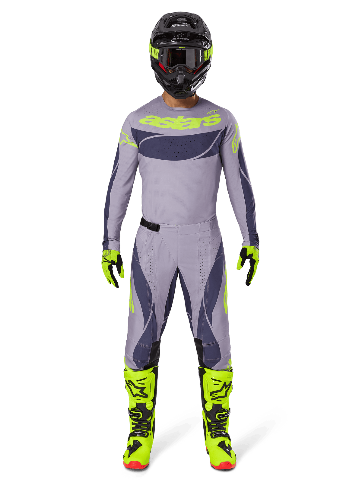 Pilota di motocross con abbigliamento completo da gara Alpinestars, Maglia Techstar Dreem 2025 in grigio e grigio scuro con loghi giallo neon, pantaloni coordinati grigio e grigio scuro, stivali giallo neon e neri, casco nero con accenti neon, completo professionale per motocross