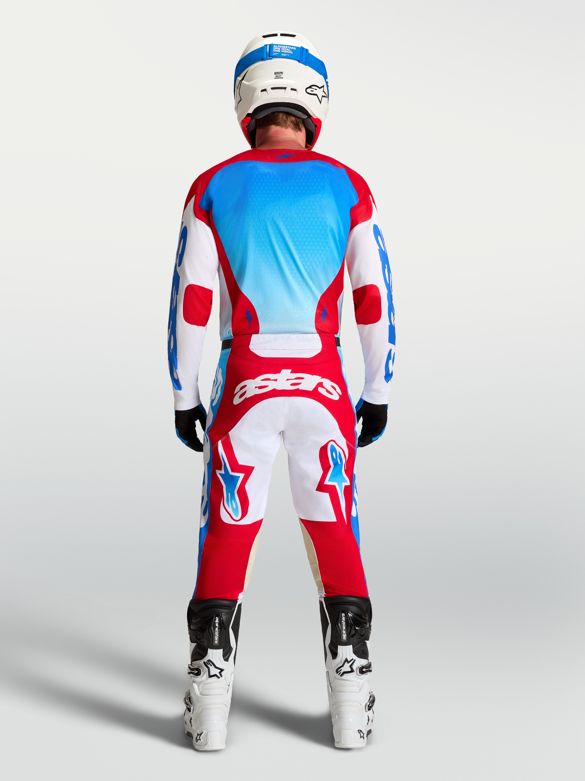 Alpinestars pantaloni Racer Hunt AND completo Racer Hunt, completo motocross rosso, bianco e blu, vista posteriore.