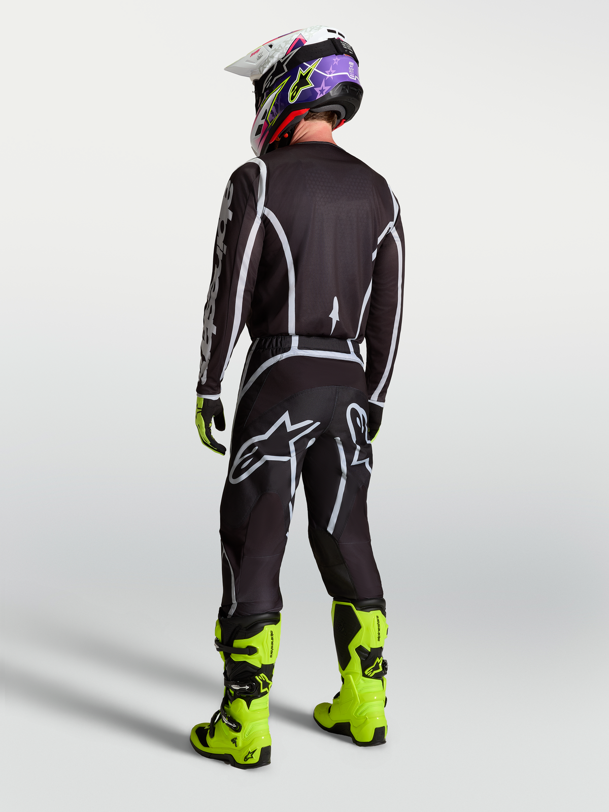 Alpinestars Maglia Fluid Apex V2, maglia da motocross da uomo, nero e argento, vista posteriore con vestibilità atletica per prestazioni fuoristrada