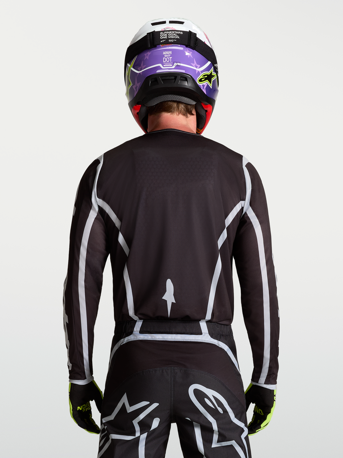 Alpinestars Maglia Fluid Apex V2, maglia motocross da uomo, nera e argento, vista posteriore con fit atletico ergonomico.