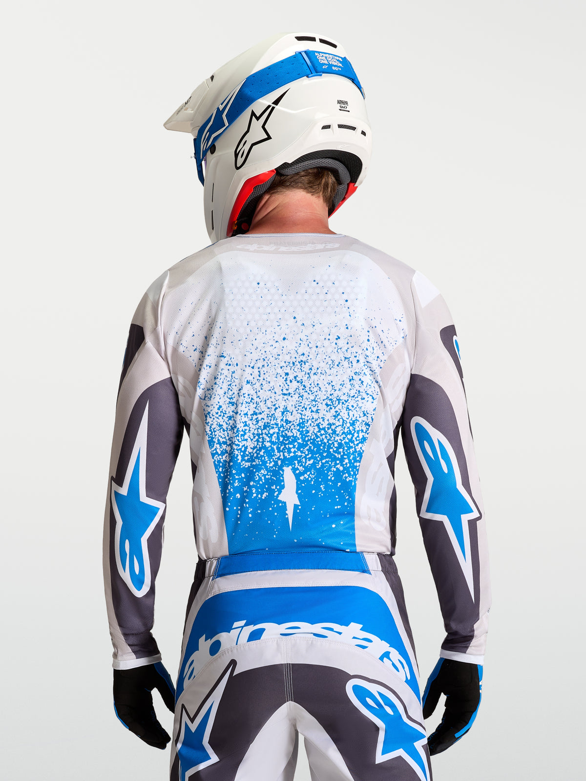 Alpinestars Maglia Fluid Drag, maglia da motocross traspirante da uomo, grigio e blu, vista posteriore, ideale per off-road.