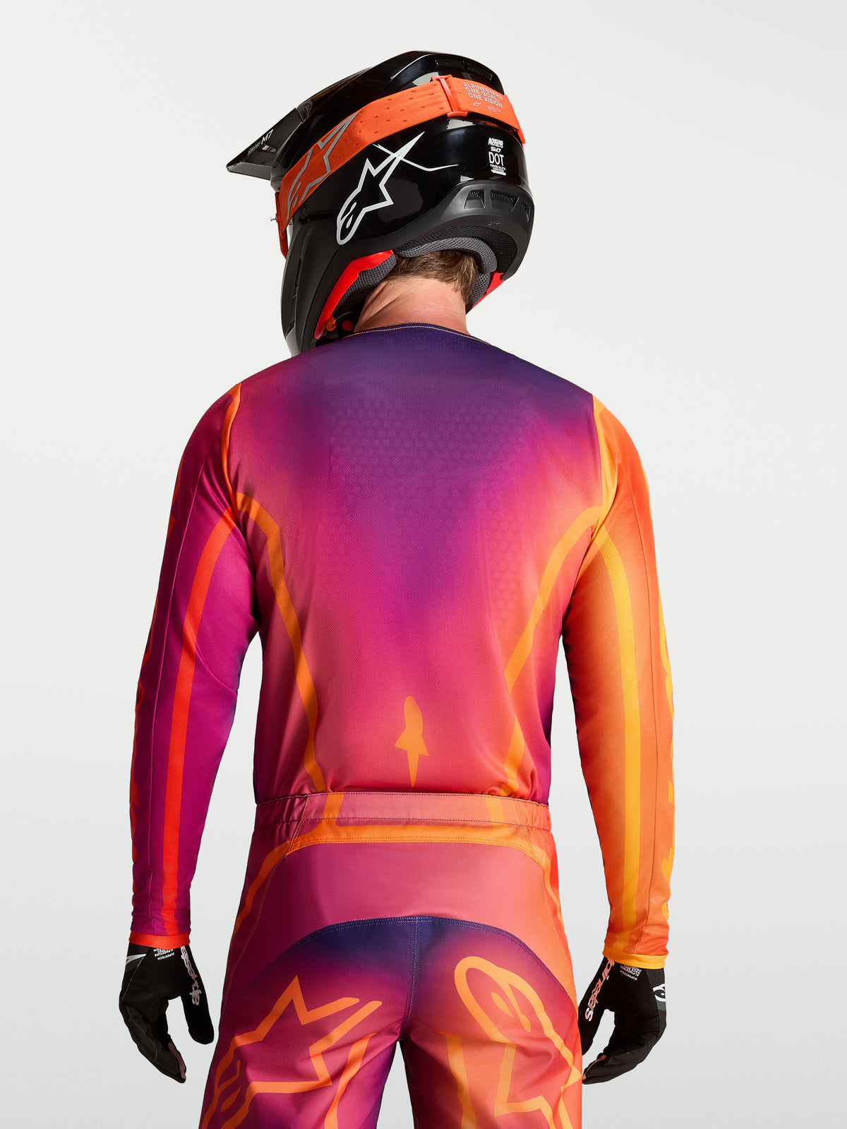 Alpinestars Maglia Fluid Kepler, maglia da motocross da uomo, viola e arancione, vista posteriore, tessuto tecnico traspirante.