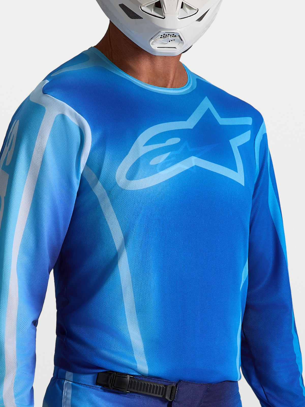 Maglia Alpinestars Fluid Kepler, maglia da motocross blu e azzurra, tessuto tecnico traspirante e vestibilità atletica.