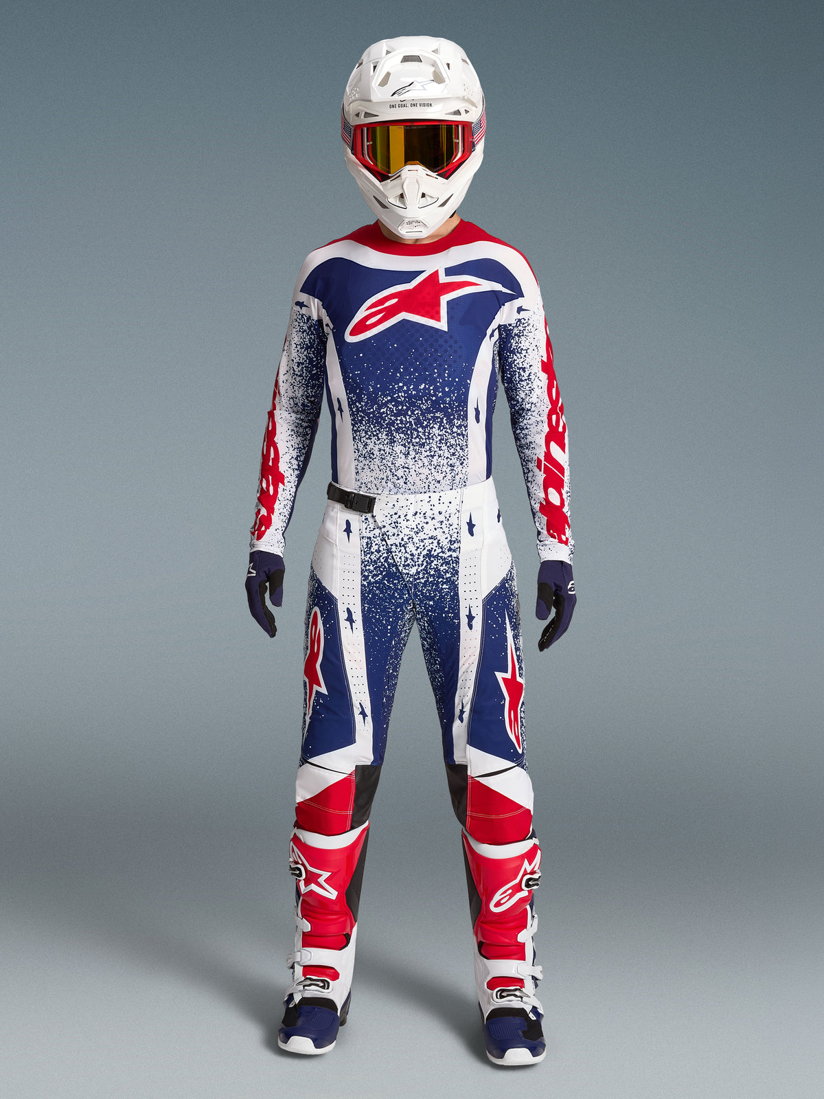 Alpinestars Techstar Unity Maglia Limited Edition, completo motocross uomo, blu, bianco e rosso con grafiche racing punteggiate.