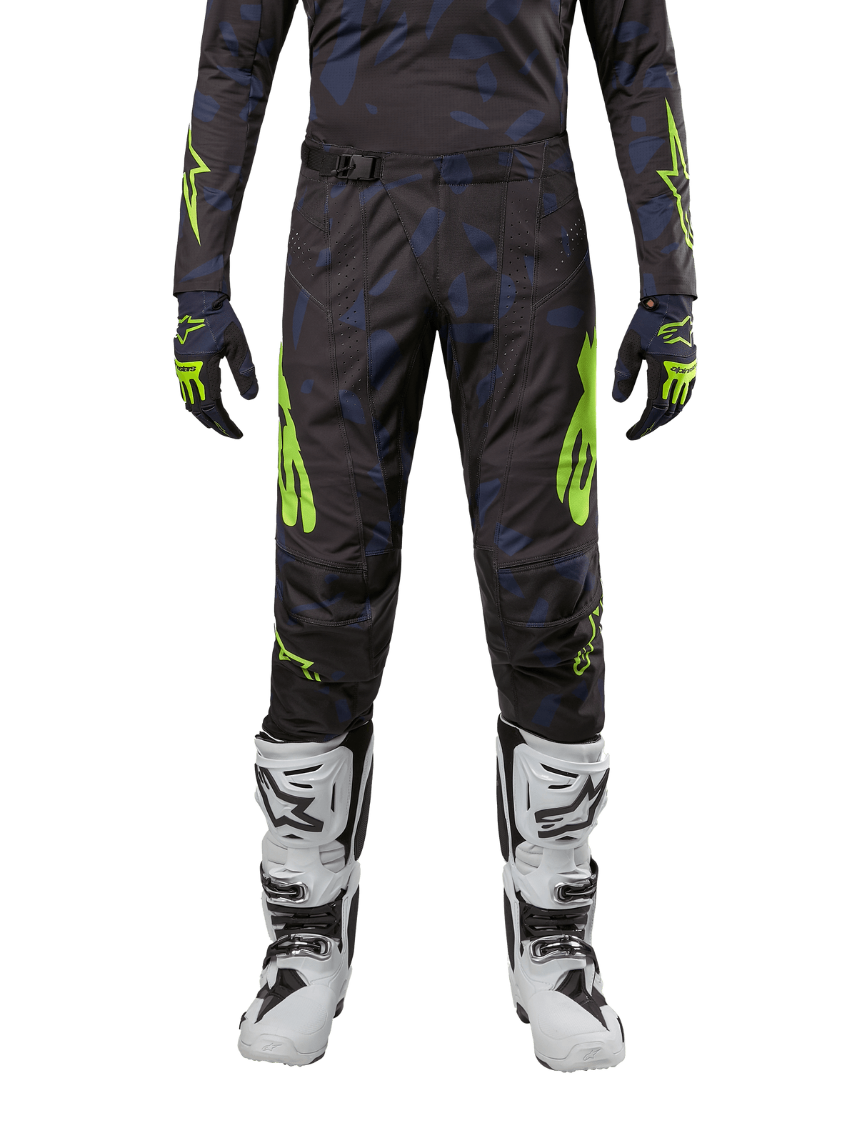 Alpinestars Pantaloni Techstar Rantera 2024, pantaloni da motocross, nero, navy e giallo fluo, indossati con maglia a maniche lunghe abbinata, guanti e stivali da motocross bianchi, con accenti giallo neon e motivo astratto scuro.
