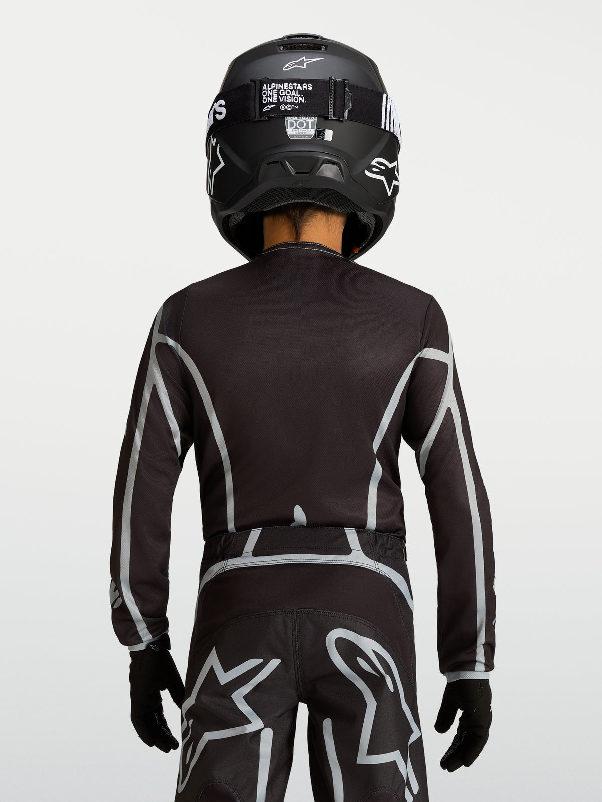 Alpinestars Maglia Fluid Apex V2 Ragazzo, maglia motocross nera e argento, vista posteriore con fit ergonomico off-road