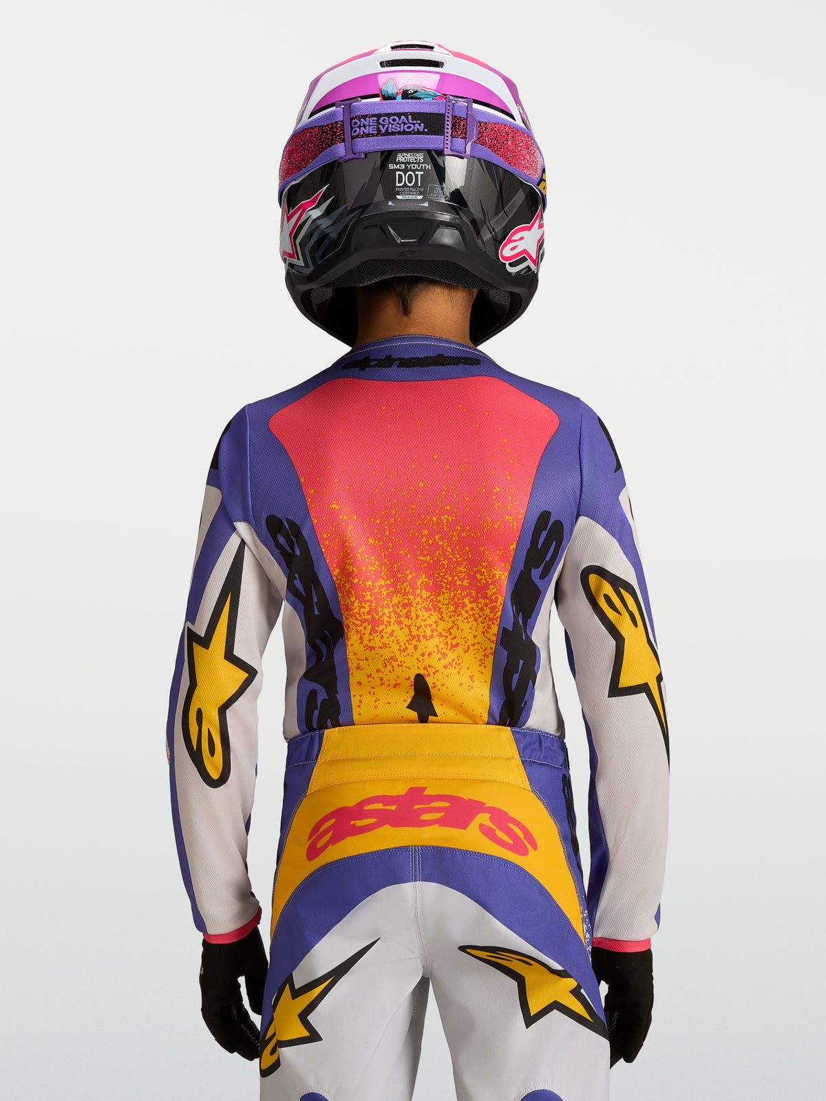 Alpinestars Maglia Fluid Drag Ragazzo 2027, maglia da motocross blu e gialla, vista posteriore con grafiche racing vivaci.