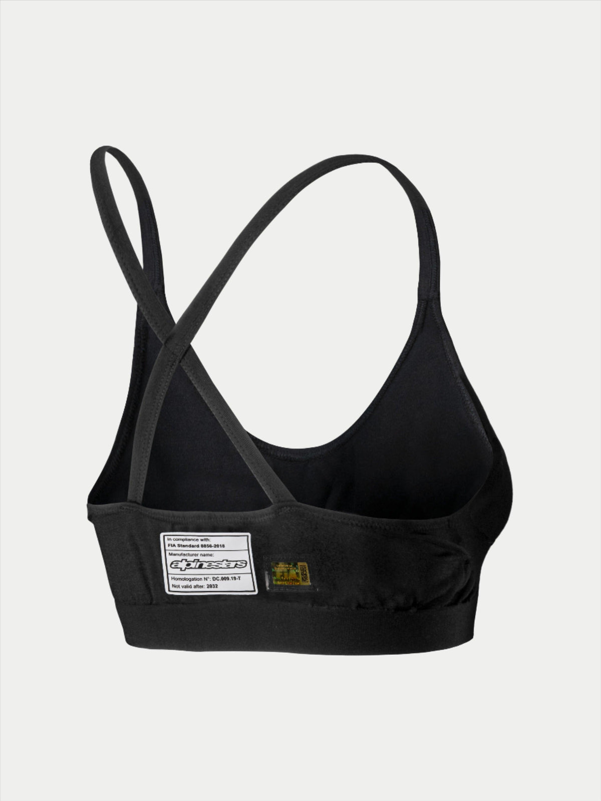 Alpinestars Stella TECH ZX Bra, reggiseno intimo tecnico per gare automobilistiche, nero, vista posteriore con etichetta di certificazione FIA 8856-2018, spalline sottili incrociate, materiale leggero resistente alle fiamme per protezione motorsport.
