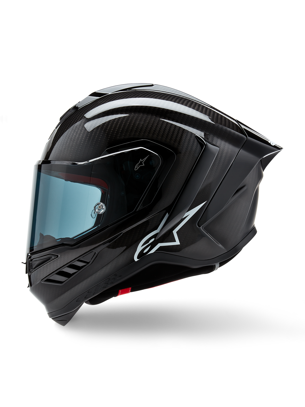 Casco Alpinestars Supertech R10 Solid, casco integrale racing da moto, carbonio nero opaco e lucido, trama in fibra di carbonio a vista, logo Alpinestars bianco sul lato, design aerodinamico con spoiler posteriore integrato e prese d'aria, vista laterale di profilo